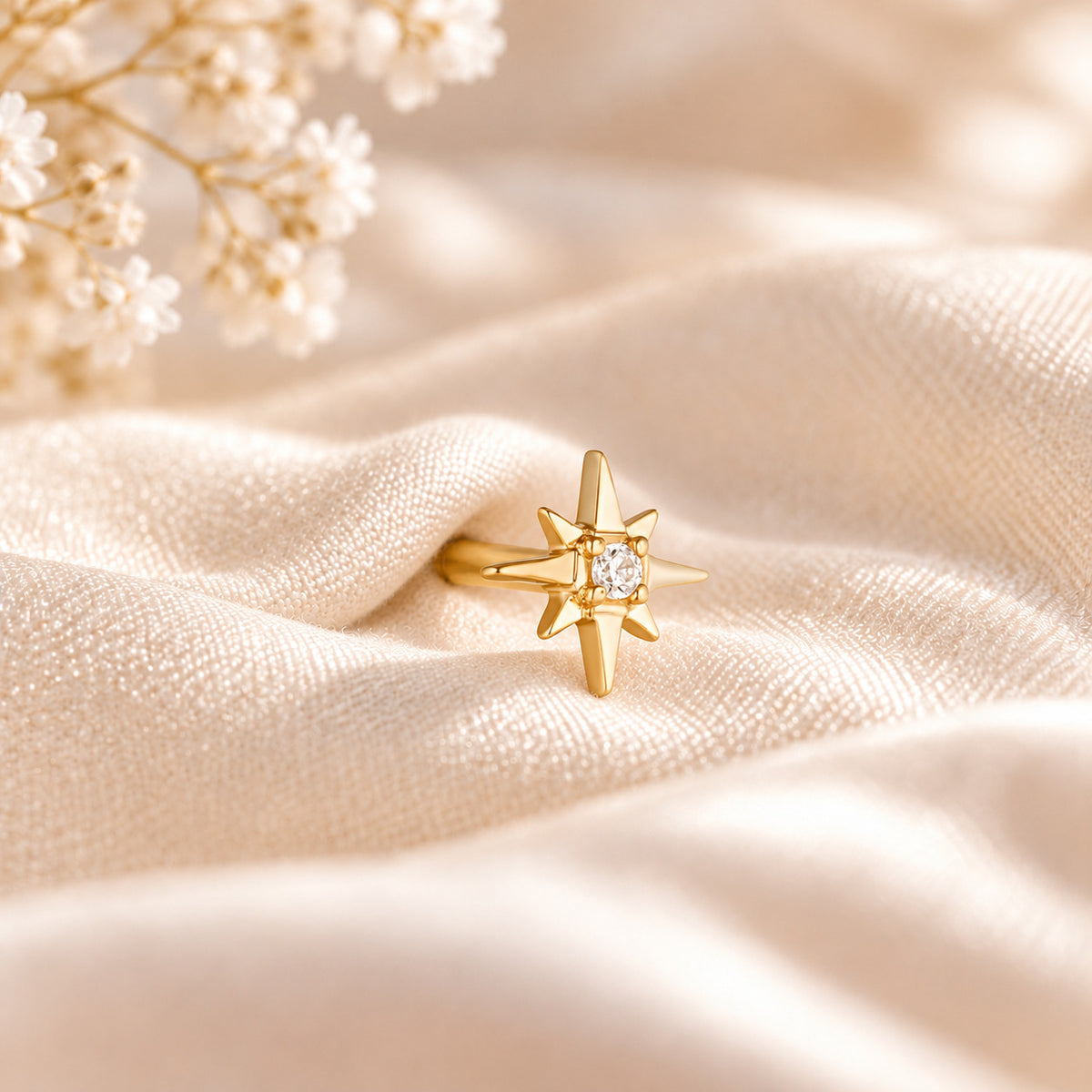 Esther star flat back stud in 14K solid gold on cream silk
