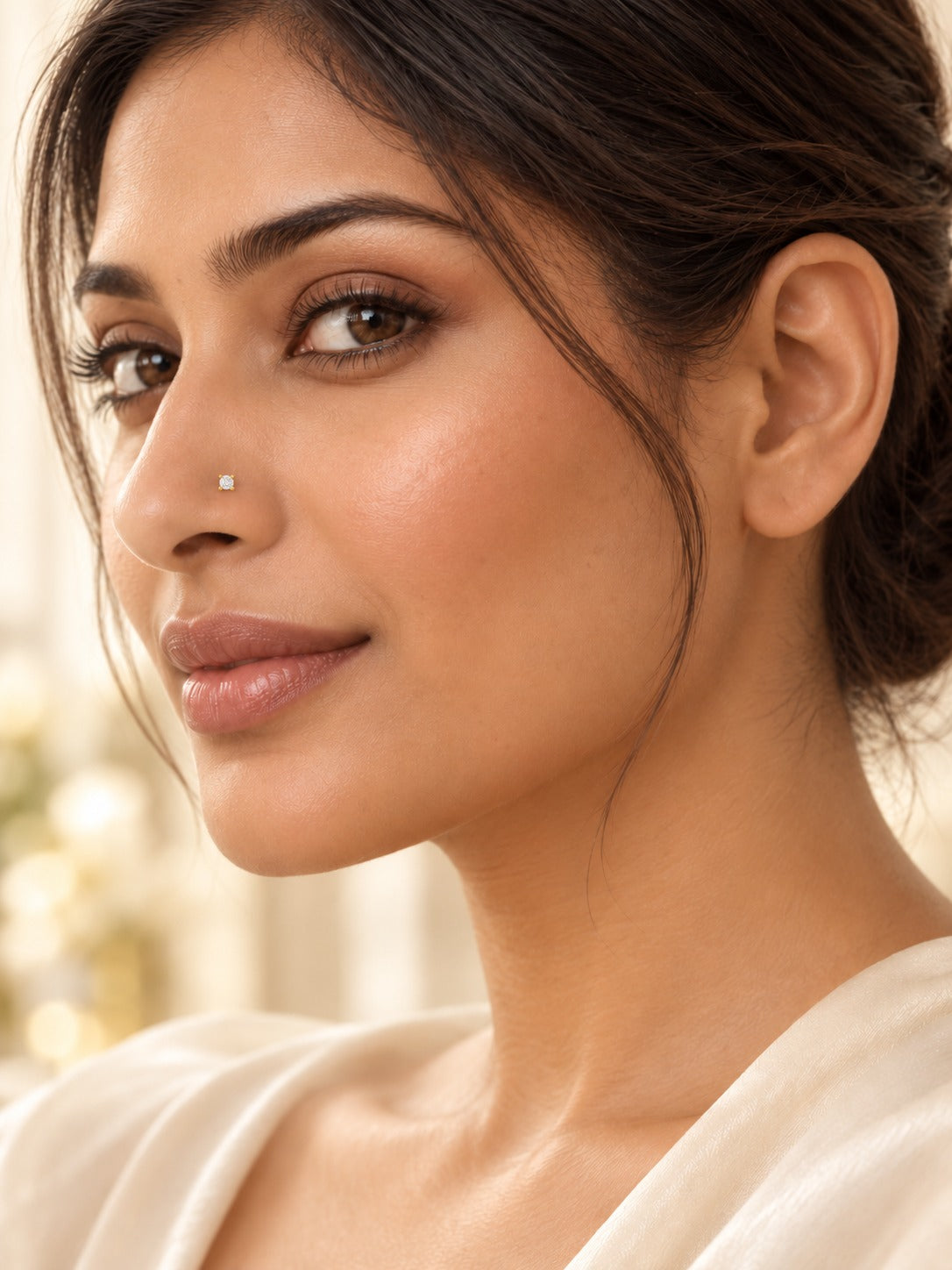 Julia diamond nose stud in a nostril piercing