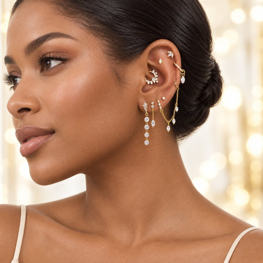 Gold ear stack with a chain and lobe drops